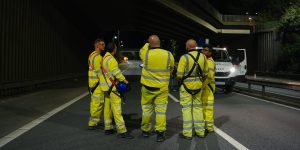 A group of workers in hi viz clothing on the road